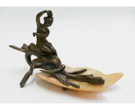 Victorian bronze figurine of a lady riding on dolphin amongst bulrushes on mother of pearl base 15cm long 