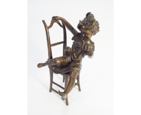 Contemporary green patinated bronze of young girl on chair teasing a cat - height 23cm tall 