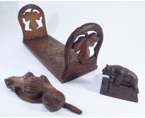 Collection of treen to include Black Forest bear style ashtray, walnut inkwell and an adjustable bookslide 