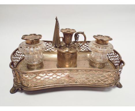 An Edwardian hallmarked silver presentation desk top ink stand of shaped rectangular form with pierced edges, candle snuffer 