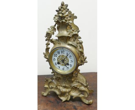 French striking mantel clock in decorative gilt and rococo style case, approx 16" tall 