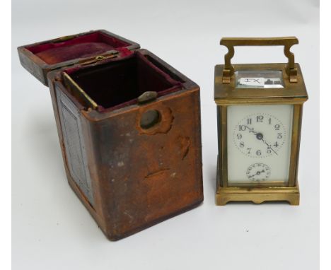 French gilt brass carriage clock with key and alarm in travelling case, cream enamel dial and Arabic numerals.  Height includ