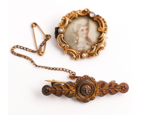 Antique brooch with portrait miniature to the centre of a lady painted on ivory panel in a scrolled frame set with 5 cut diam
