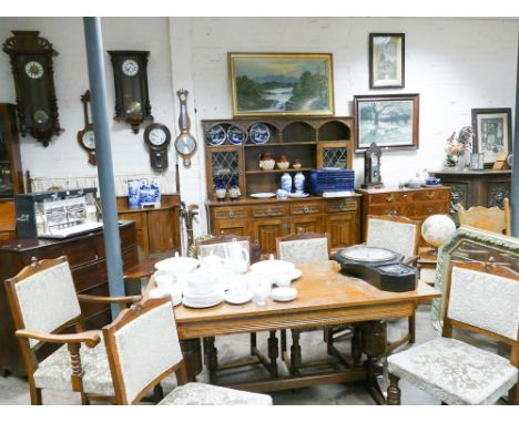 Good quality linen fold panel carved medium oak dining suite comprising closed back dresser with leaded glazed cabinets above