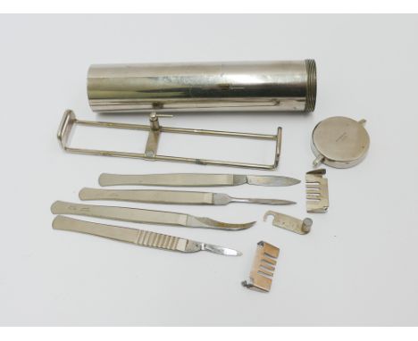 Set of stainless steel and nickel surgeons tools in a cylindrical screw on canister signed Holborn London 