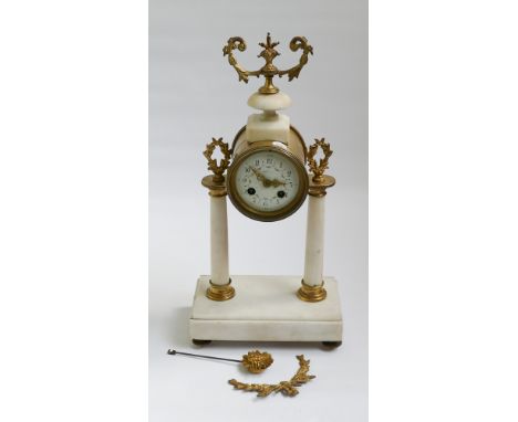 French striking mantel clock on white marble stand with gilt decoration 