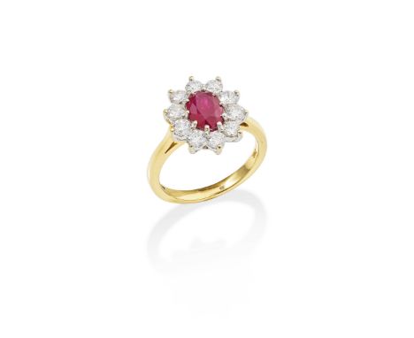 BAGUE RUBIS ET DIAMANTSOrnée d'un rubis taille ovale entouré de diamants taille brillant,  poinçons français d'occasion pour 