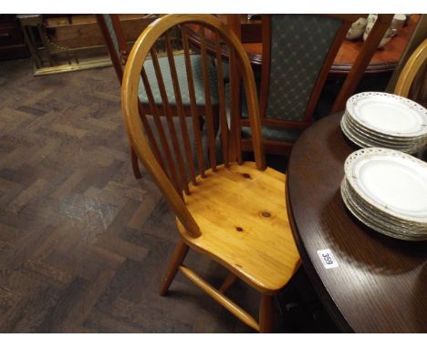 Set of four stained pine stick back dining chairs 
