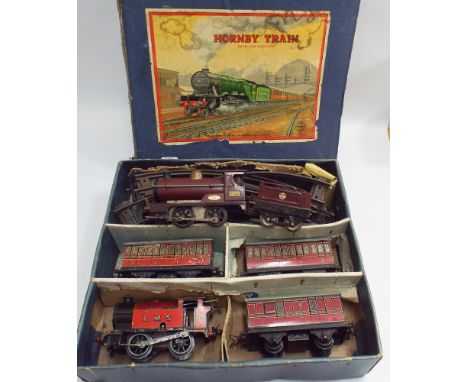 Boxed tin plate Hornby clock work train set and an engine and an extra tender 