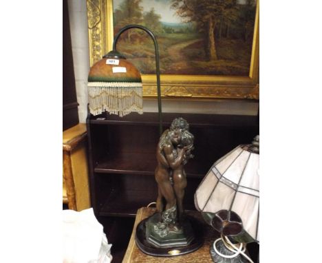 Bronze effect figure table lamp with decorative shade, Tiffany style lamp and a Tiffany style lampshade 