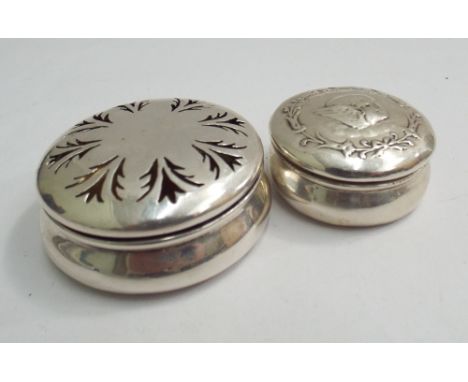 Edwardian silver trinket box with hinged pierced lid, Birmingham 1907, 5cms diameter, together with a smaller cherub embossed
