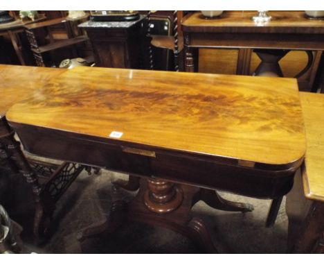 3' Regency mahogany folding top card table on turned pillar and quadruple base with brass paw feet   Condition - 4" strip of 