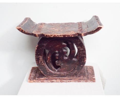 Carved native stool 22" wide 