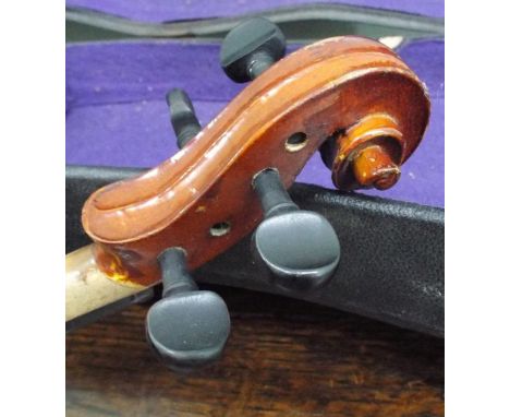 Violin in case bearing Stradivarius label 