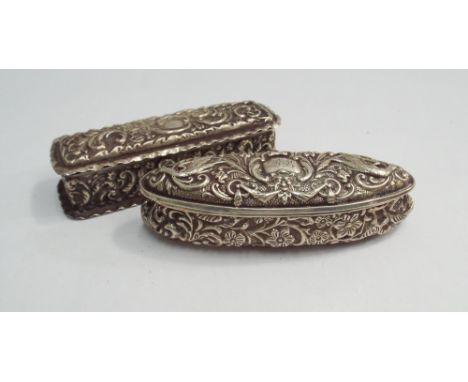 Two silver trinket boxes, each with embossed decoration, Birmingham hallmarks, longest 10.5 cms 