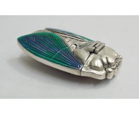 Silver plated vesta case modelled as a scarab beetle with blue and green enamel decorated wings, 6cm long 