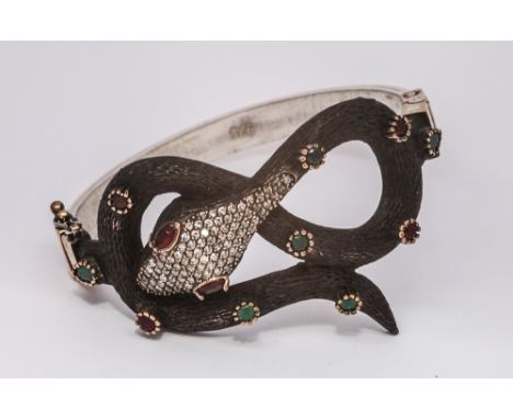 Ladies hinged bangle of a snake design with inset paste.  Bangle stamped 925