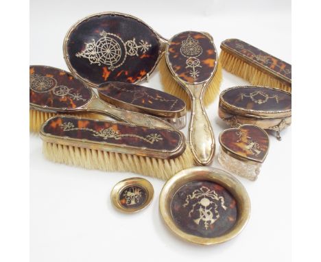 Early 20th Century tortoiseshell and silver inlaid 5 piece pique work dressing table set, and a similar oval silver and torto