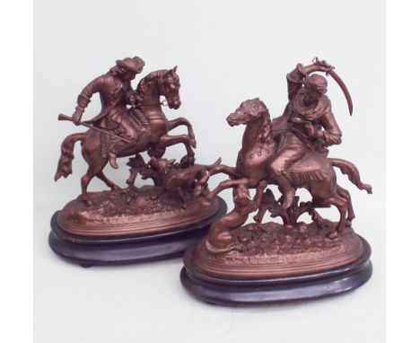 Pair of bronze effect spelter figures of huntsmen on horse back standing 11" tall 
