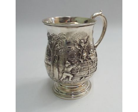 Victorian silver tankard with embossed decoration of children playing on a gate in a woodland setting, plain cartouche to one