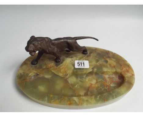 Art Deco oval pin tray with bronze tiger mount on green onyx base by Asprey, London.
10 inches long (with ivorine labels to t