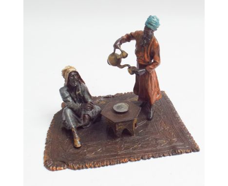 Cold painted bronze model of 2 Arabs drinking tea on a rug, 12cm wide x 10cm high 