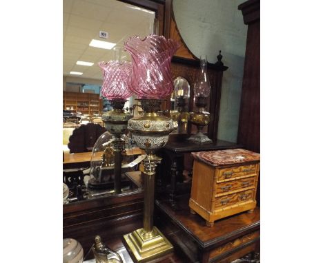Victorian brass Corinthian column oil lamp with cranberry shade 29" tall