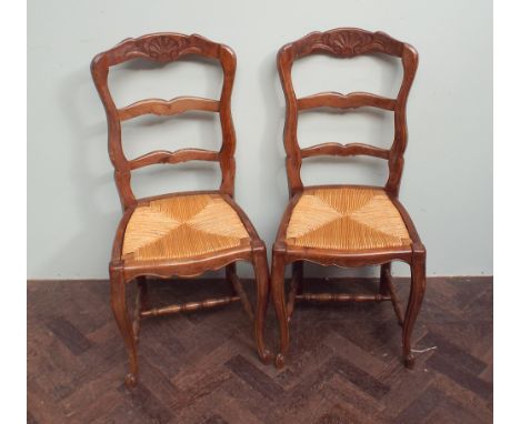 Set of six French country oak ladder back dining chairs with drop in rush seats 
