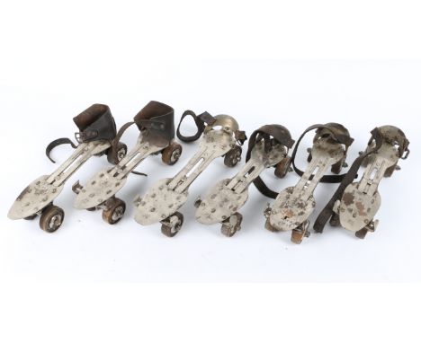 FOUR PAIRS OF STEEL AND LEATHER STRAPPED ROLLER SKATES, together with a pair of child's leathers boots and ice skates, two fu