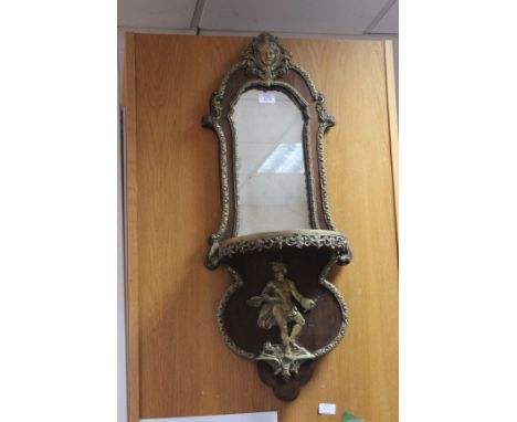 AN 18TH CENTURY FRENCH STYLE WALNUT WALL MIRROR AND SHELF of shaped outline and with ormolu style mounts, 34cm wide x 85cm hi