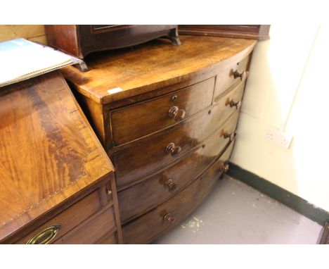 A VICTORIAN MAHOGANY BOW FRONTED CHEST of two short and three long drawers with turned knob handles and bracket feet, 103cm w