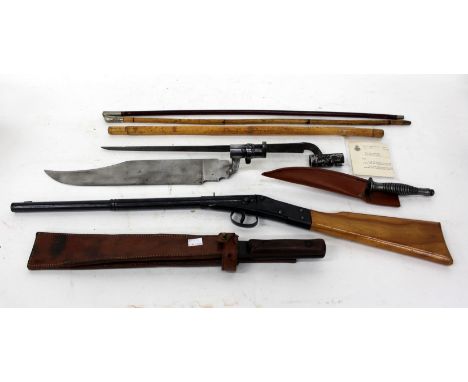 THREE SWAGGER STICKS a World War II square end machete dated 1945, a plastic film prop bayonet, a 1930's British Hot Shot boy