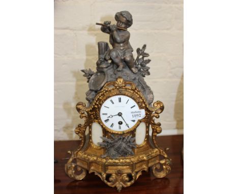 A 19TH CENTURY MANTLE TIMEPIECE the gilt metal case with marbled panel surmounted by a silvered figure of a boy playing a flu