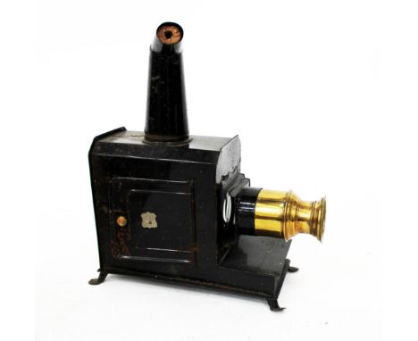 AN OLD BLACK ENAMELLED MAGIC LANTERN WITH BRASS LENS "THE EMPIRE" 29.5cm high together with a small group of magic lantern sl
