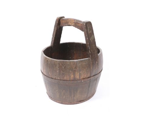 AN OLD COOPERED IRON BOUND BUCKET with a handle to the top 39cm diameter together with an 18th or 19th Century black painted 