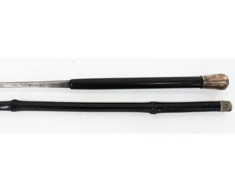 AN ANTIQUE FRENCH SWORD STICK with decorative white metal finial, ebonised handle, the square blade stamped 'France' and with