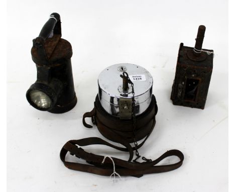 AN OLD CLOCKWORK PIGEON TIMER by the National Time Recorder Ltd., with leather case together with two old lamps 