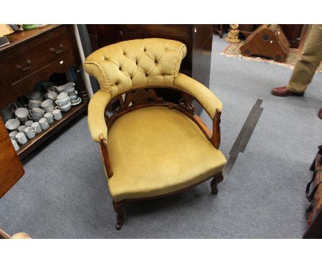 AN EDWARDIAN MAHOGANY FRAMED TUB CHAIR with button upholstered back and seat 