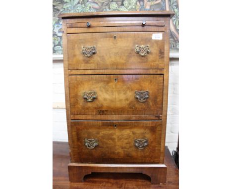 A SMALL WALNUT CHEST with slide over three drawers and on bracket feet, 46cm wide x 76cm high
