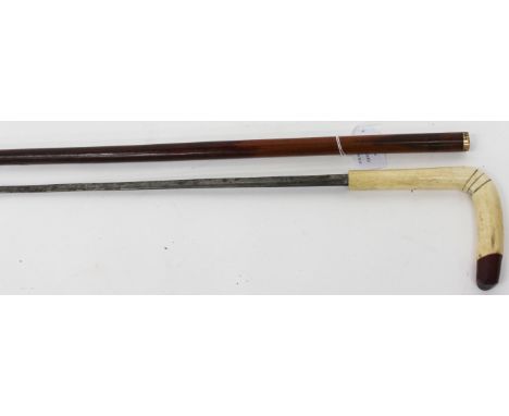 AN ANTIQUE, POSSIBLY FRENCH SWORD STICK with horn handle and malacca body and with a shaped steel blade, 87cm long overall