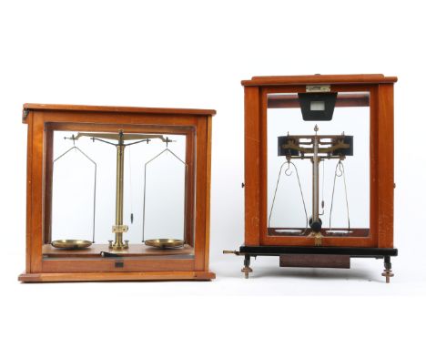 A SET OF MAHOGANY CASED LABORATORY SCALES by F.E. Becker & Co. 40.5cm wide x 40cm high together with a cased set of weights a