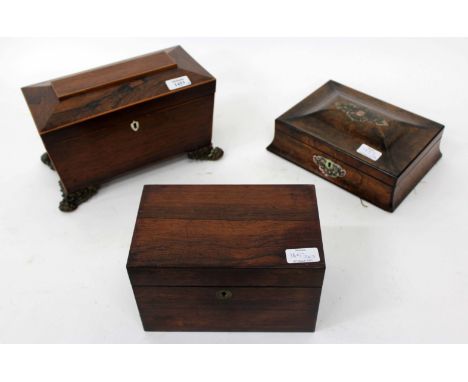 A VICTORIAN ROSEWOOD TEA CADDY of sarcophagus form with fitted interior standing on gilt hairy paw feet, 32cm wide together w