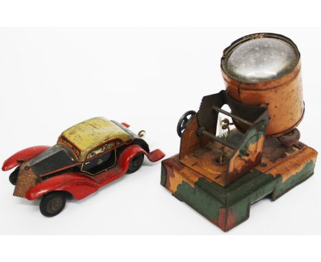 A PRE WAR TIN PLATE PAINTED SEARCH LIGHT together with a tin plate toy car, registration G.S. SLX (2)