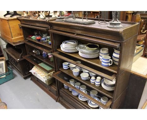 A PAIR OF GLOBE WERNICKE BOOKCASES each with three sections and drawers to the base 89cm wide 