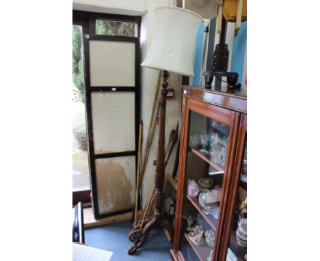A CARVED MAHOGANY LAMP STANDARD with reeded column support, acanthus leaf carved tripod base terminating in claw and ball fee