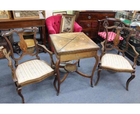 A LATE VICTORIAN OR EDWARDIAN ROSEWOOD ENVELOPE CARD TABLE with decorative inlay, cabriole legs united by a stretcher and und