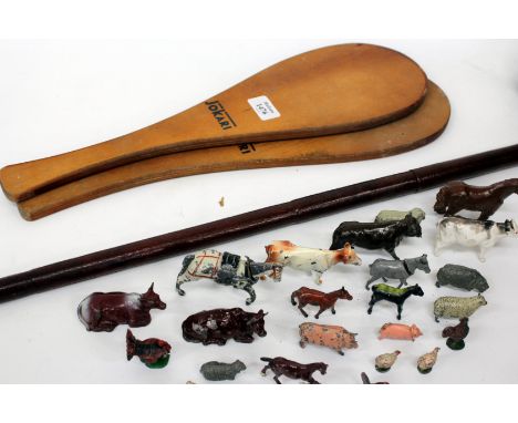 A SWAGGER STICK with blade within, signed Swalle & Adeney, also two Jokari bats, a small group of lead farm animals and a Mr 