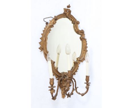 A 19TH CENTURY GILT GESSO THREE LIGHT GIRANDOLE WALL MIRROR with scroll carved frame and acanthus leaf decoration 51cm wide 