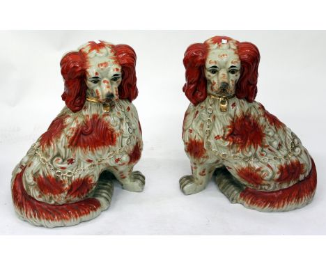 A LARGE PAIR OF STAFFORDSHIRE TYPE CERAMIC SPANIELS each approximately 59cm tall 