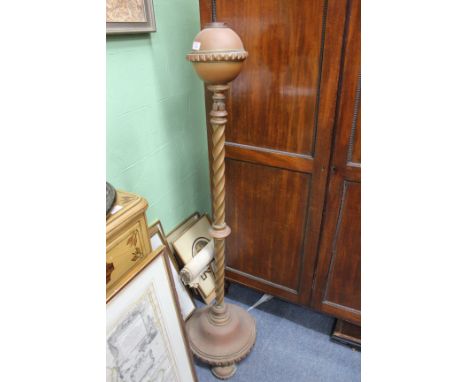A VICTORIAN BRASS STANDARD LAMP BASE with column support and standing on a circular spreading base and three circular feet to